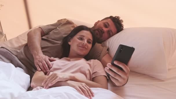 Young Dark Haired Biracial Woman Bearded Husband Lying Bed Hotel — Stock video