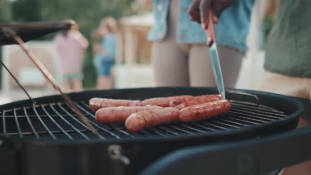 Low Angle Close Cropped Guy Roasting Sausages Grill Flipping Them — Stock videók