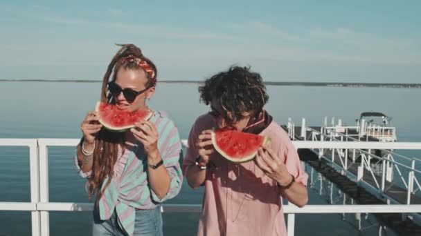 Medium Young Woman Dreadlocks Caucasian Guy Eating Fresh Watermelon Standing — Vídeo de Stock