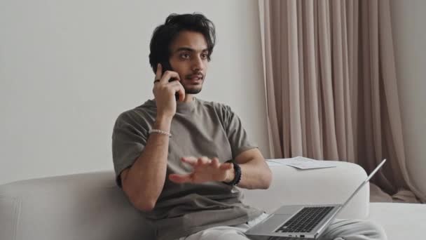 Medium Long Middle Eastern Young Male Freelancer Sitting Living Room — Vídeo de Stock