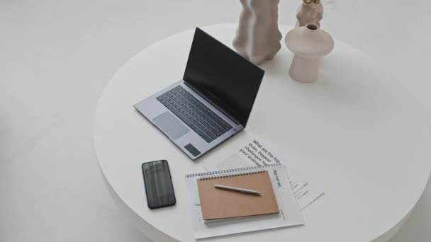 High Angle White Coffee Table Laptop Computer Smartphone Documents Notebook — Vídeo de Stock