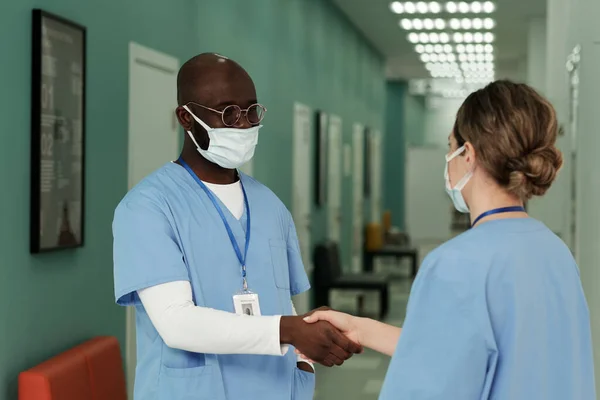 Young Interracial Healthcare Workers Shaking Hands One Another Beginning New — Foto de Stock