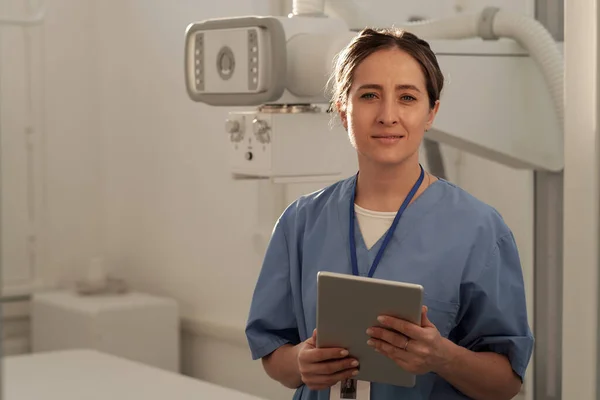 Happy Young Contemporary Female Clinician Blue Uniform Holding Tablet While — Stockfoto