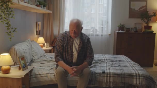 Medium Long Bored Senior Caucasian Man Sitting Bed Home Evening — Stock video