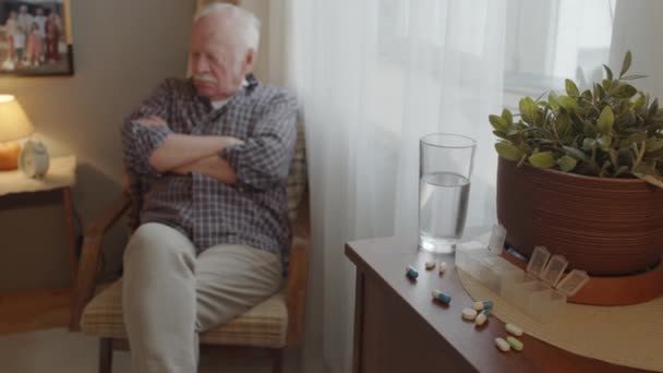 Medium Long White Haired Caucasian Man Sitting Armchair Window Foreground — Stockvideo