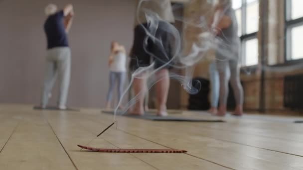 Low Angle Incense Stick Holder Smoking Floor Yoga Studio Blurred — Stok video