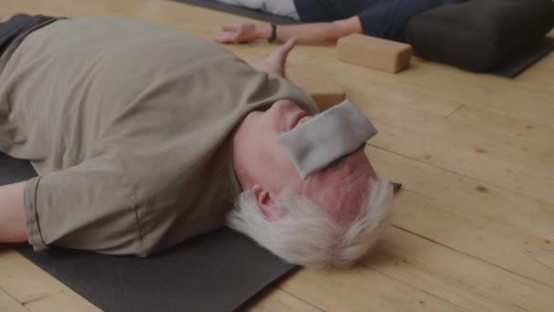 Medium Long Senior Caucasian Man Lying Back Floor Modern Yoga — Vídeos de Stock