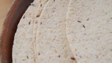 Close up tracking shot of soft flour tortillas for preparing mexican food