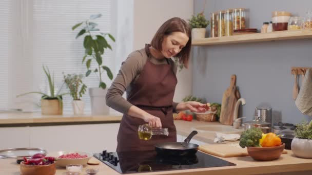 Woman Apron Pouring Oil Hot Pan While Cooking Dinner Kitchen — Stockvideo