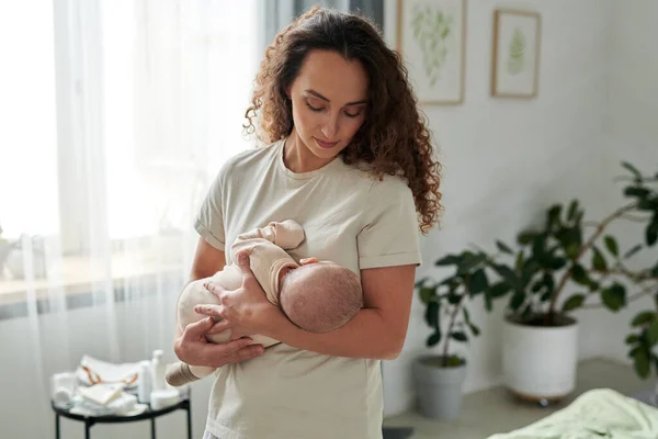 Contemporary Young Mother Shirt Holding Newborn Baby Her Chest While — стоковое фото