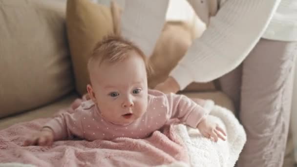 Medium Long Cute Blue Eyed Biracial Baby Girl Lying Stomach — Stock videók