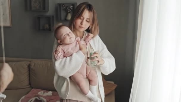Medium Young Brown Haired Biracial Woman Holding Adorable Infant Pink — Video Stock