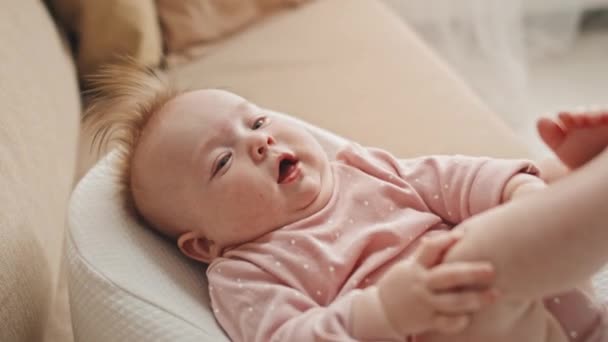 Medium Long Adorable Blue Eyed Biracial Infant Pink Onesie Pacifier — Stockvideo