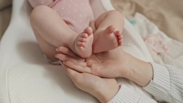 Top Unrecognizable Mother Holding Feet Her Baby Girl Hands Home — Stock videók