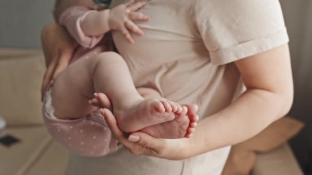 Selective Focus Hands Cropped Woman Holding Feet Rocking Sleeping Baby — Vídeos de Stock