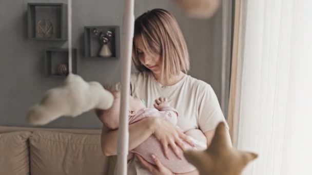 Medium Young Biracial Woman Rocking Baby Sleep Home Afternoon Infant — Vídeos de Stock