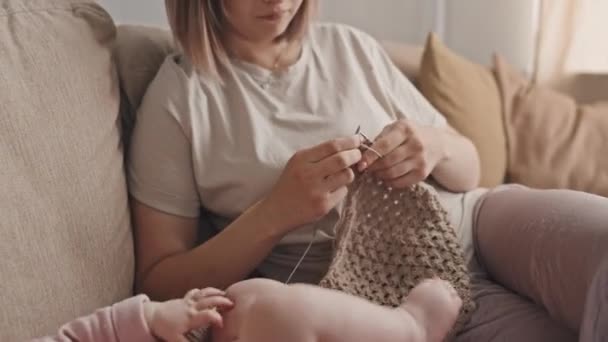 Tilting Brown Haired Biracial Woman Loungewear Sitting Sofa Home Knitting — Vídeo de Stock