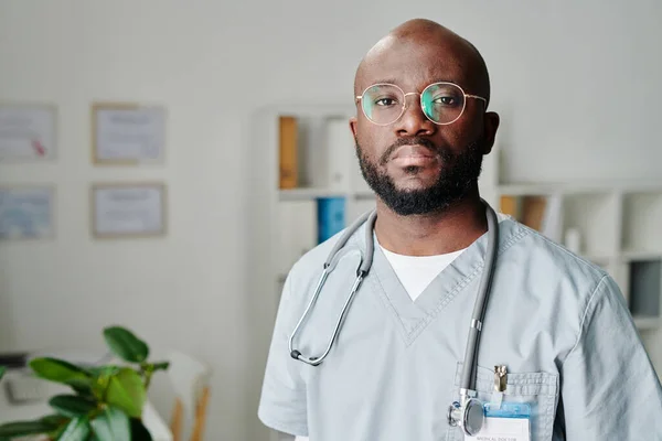 Young Contemporary African American Male Clinician Eyeglasses Blue Uniform Standing — Stok fotoğraf