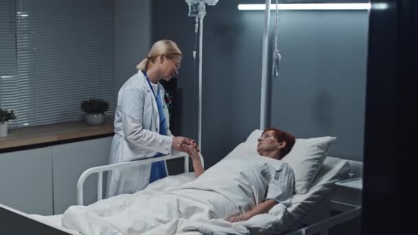 Medium Long Mature Female Doctor Holding Hand Redhead Older Patient — Video