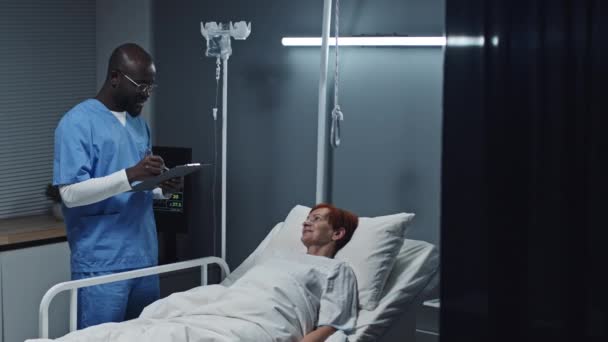 Medium Long Young Black Male Nurse Wearing Blue Scrubs Taking — Stok video