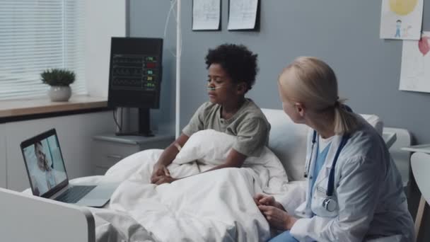 Medium Black Boy Oxygen Tube Nose Sitting Bed Blond Female — Stok video