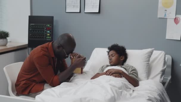 Medium Long Young Nervous Black Man Sitting Bed Unconscious Boy — Stock video