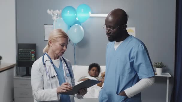 Medium Blue Eyed Blonde Caucasian Female Doctor Wearing Medical Gown — Stok Video