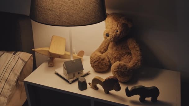 High Angle View Stuffed Bear Various Wooden Toys Lit Lamp — Stok video