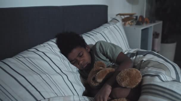 Medium Long Cute Black Boy Hugging Stuffed Bear Sleeping His — Vídeos de Stock