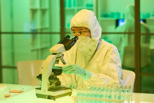 Young Female Scientist Protective Biohazard Suit Respirator Gloves Eyeglasses Looking — Foto de Stock