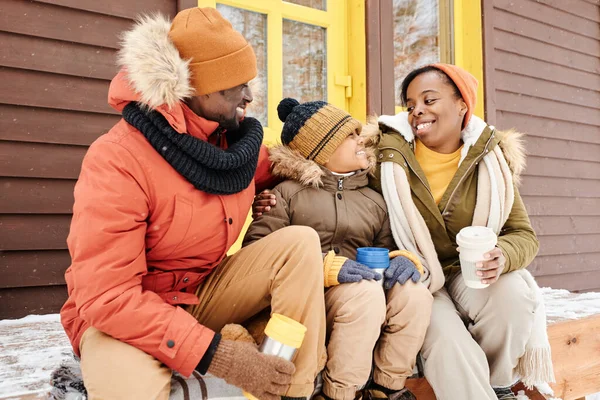 Cheerful Black Woman Winterwear Looking Her Cute Son Talk While — Foto Stock