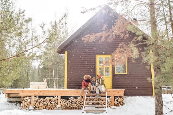 Happy Family Three Winterwear Having Chat Wooden Porch Country House — ストック写真