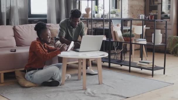 Long Shot Happy Black Hetero Couple Sitting Living Room Planning — Stock videók