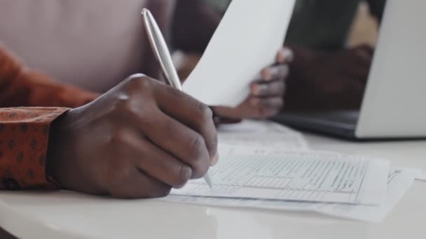 Close Hand Unrecognizable Woman Filling Tax Return Form Writing Pen — Video