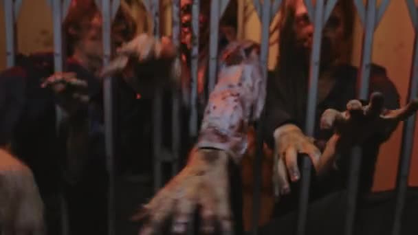 Medium View Metal Gate Old Elevator Three Zombies Reaching Hands — Stockvideo