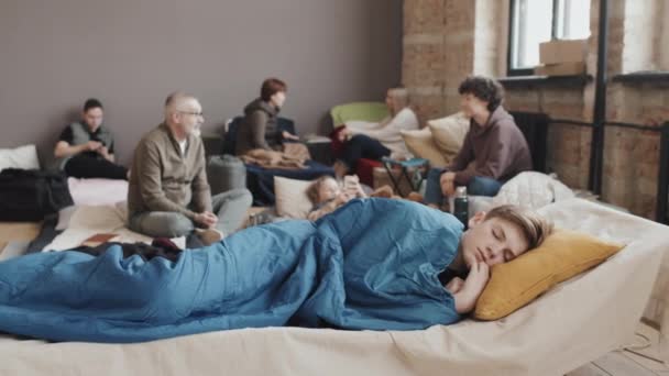 Medium Long Caucasian Tween Boy Sleeping Blanket Cot Refuge Foreground — Vídeo de Stock