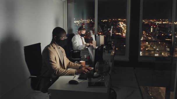 Full Shot Two Male Colleagues Working Computers Desks Dark Corporate — Wideo stockowe