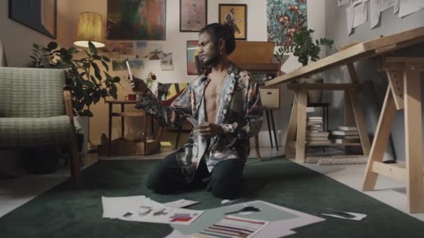Young Male Indian Fashion Designer Creating Inspirational Mood Board While — Video Stock