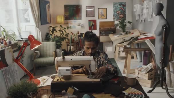 Creative Indian Fashion Designer Using Sewing Machine Colorful Messy Atelier — Video Stock