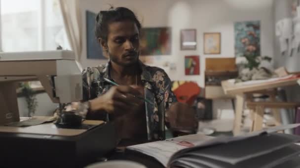 Medium Shot Young Handsome Indian Dressmaker Using Sewing Machine Taking — Video Stock