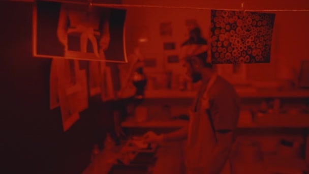 Young Indian Man Printing Processing Photos Darkroom Hanging Them Rope — Stok video