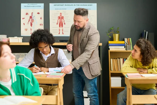 Mature Male Teacher Anatomy Checking Notes Highschool Student Consulting Him — Stock Photo, Image