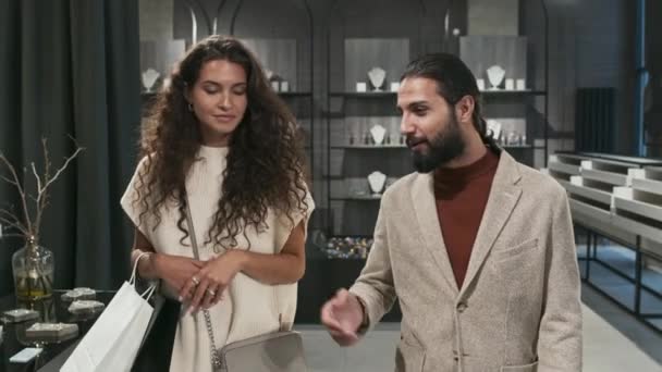 Medium Tracking Young Wealthy Biracial Spouses Talking Walking Luxury Designer — Stock Video