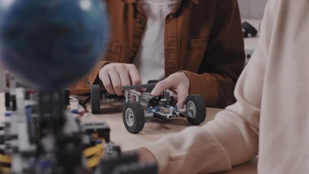 Selective Focus Shot Caucasian Teen Student Building Robotic Toy Car — Stock Video