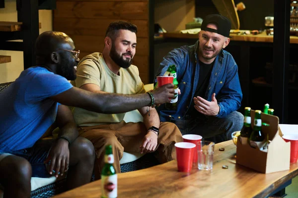 Group Young Intercultural Buddies Clinking Beer Table Cups Alcohol While — Stock Photo, Image