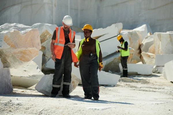 Two Young Intercultural Workers Marble Quarry Discussing Online Manual Guide — Stock Photo, Image