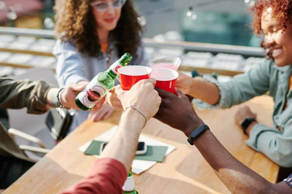 Hands Young Interracial Friends Clinking Drinks Ove Table Outdoor Cafe — Stock Photo, Image