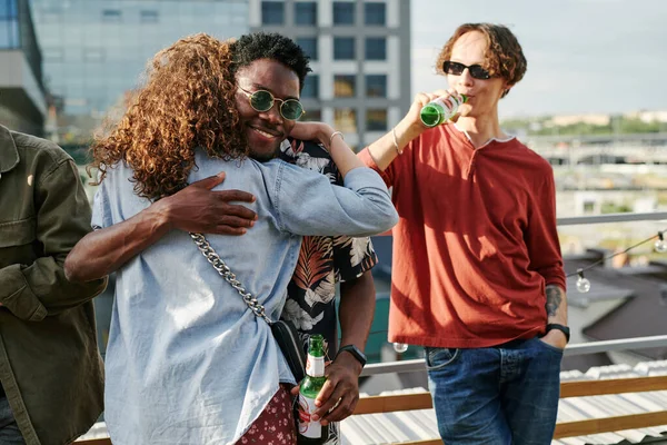 Happy Young Black Man Bottle Beer Embracing Adolescent Girl Denim — Stock Photo, Image