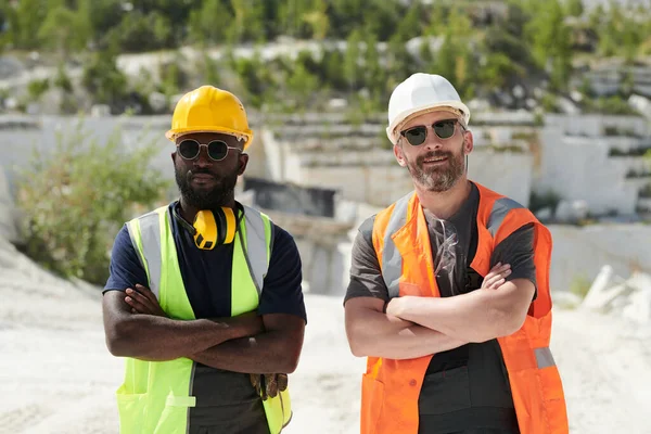Two Middle Aged Bearded Intercultural Male Workers Uniform Hardhats Crossing — Stock Photo, Image