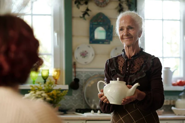 Happy Grandmother White Porcelain Teapot Moving Her Granddaughter Waiting Breakfast — Stock Photo, Image